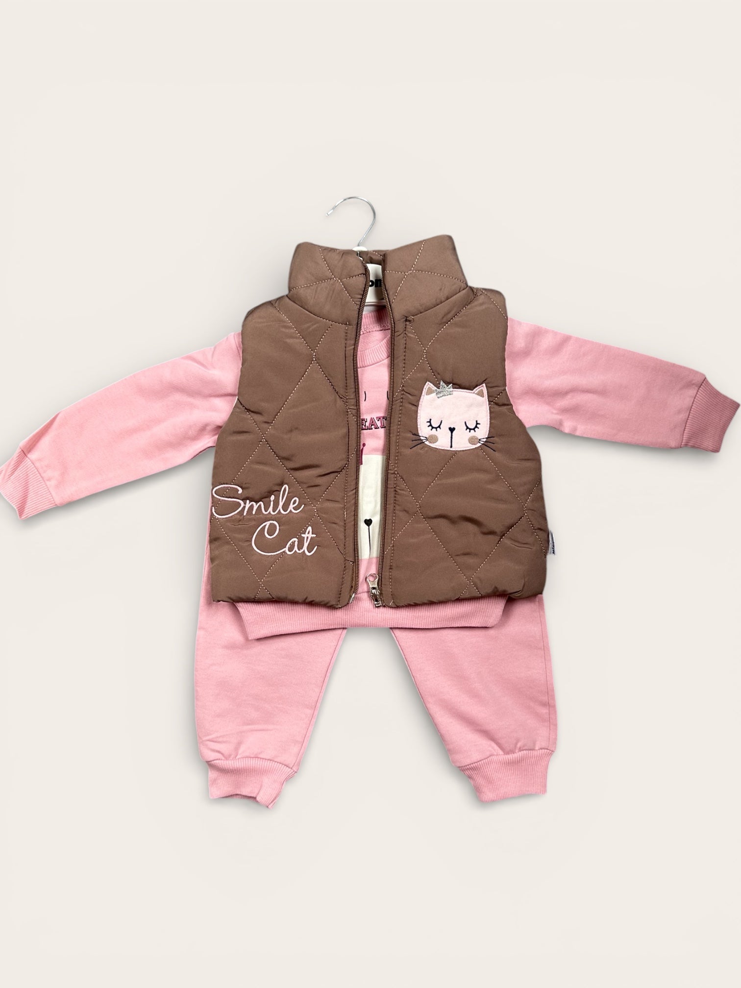 Bodywarmer, jogging pants and long sleeve shirt