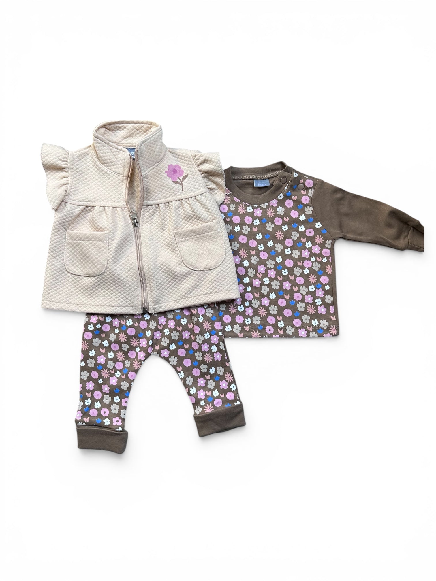 Bodywarmer, sweatpants and long sleeve shirt.